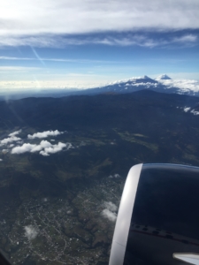 View out of airplane window of snow capped mountains in Mexico