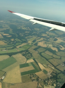 View out of airplane over UK farmland