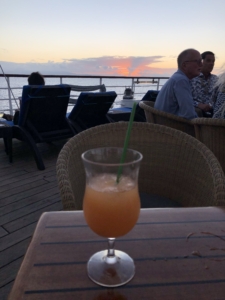 Cocktail at sunset on deck of Wind Spirit